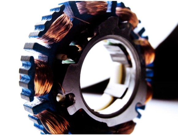 Laminated core of a radial flux electric motor stator
