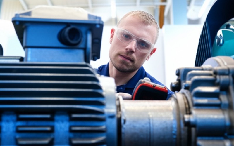 Technician diagnosing motor
