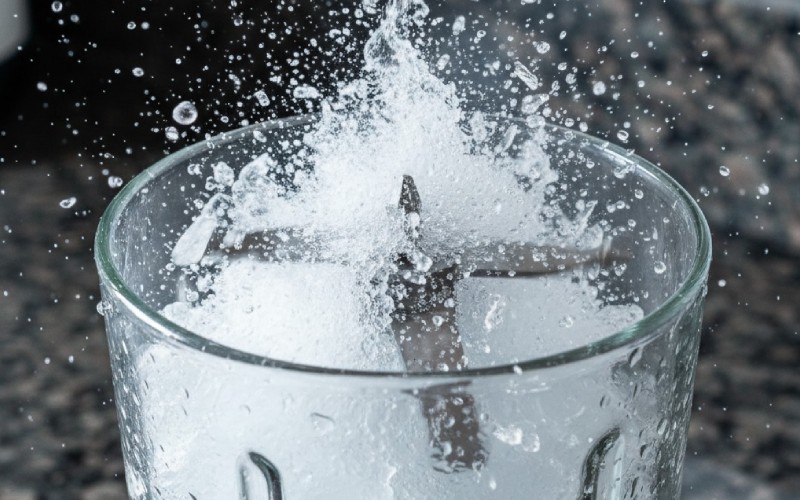 Blender blades crushing ice at high speed