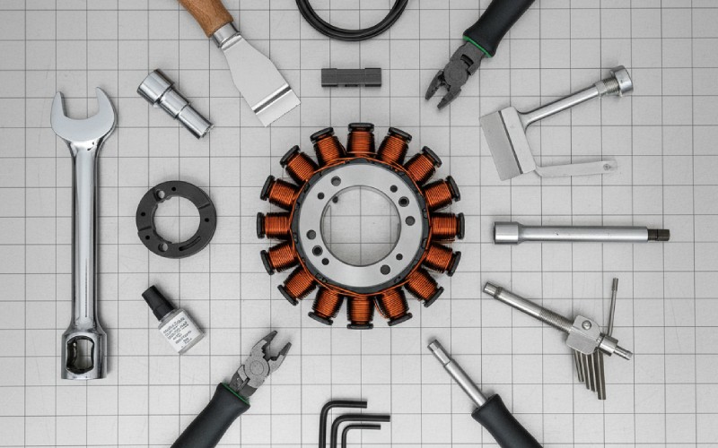 ATV stator and repair tools on workbench