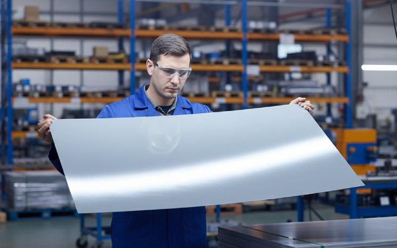 Inspecting coated electrical steel sheet