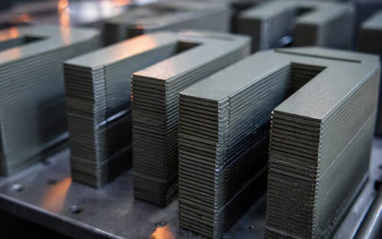 Stacked electrical steel laminations with epoxy powder coating