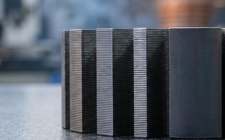 motor lamination stacks showing cut edges and heat-treatment context