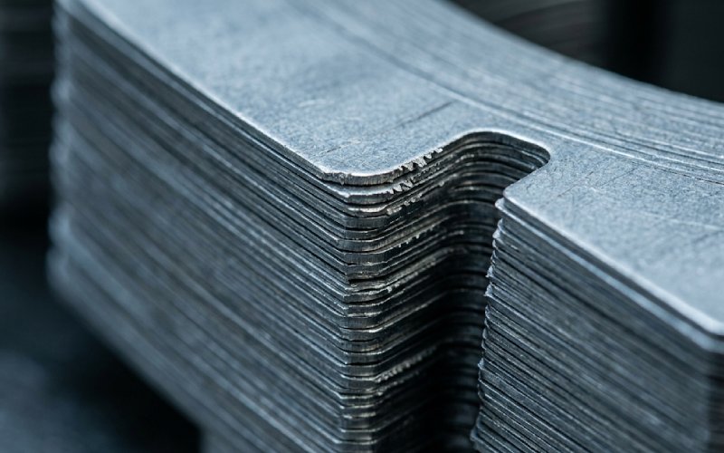 stamped motor laminations showing cut edges and stack alignment